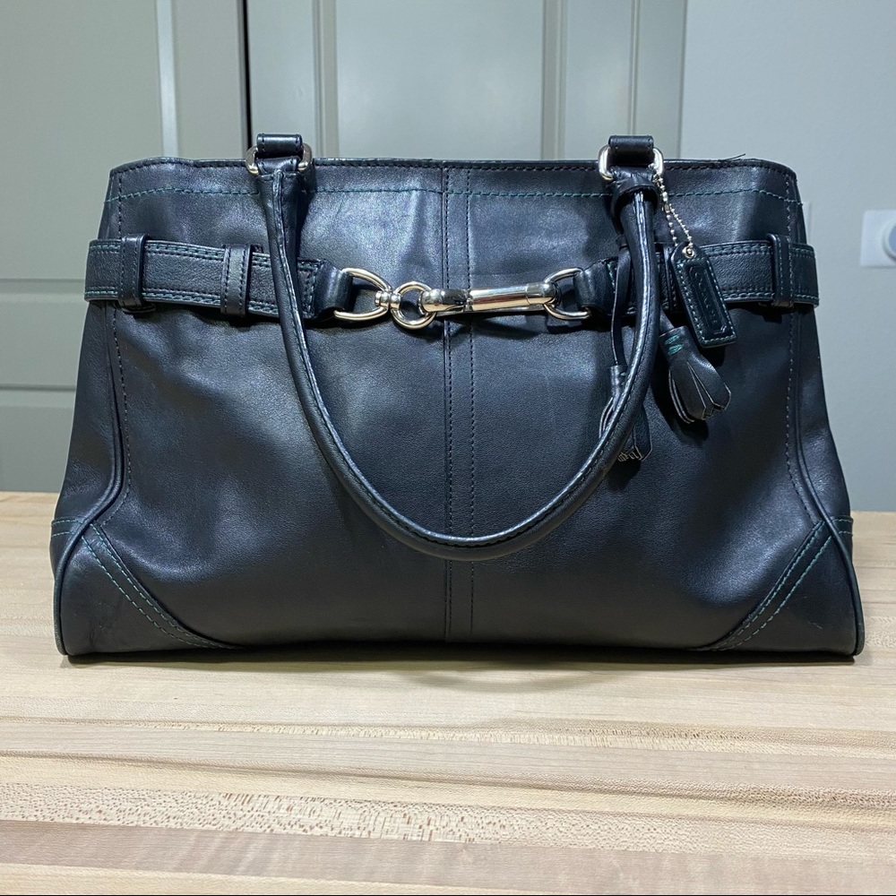 Coach black purse with teal stitching. Gently used